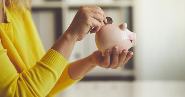 Woman Holding Piggy Bank