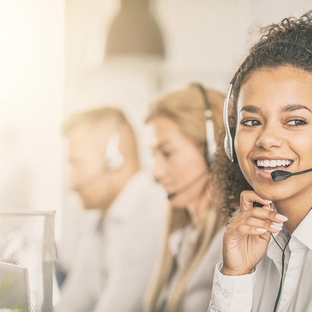 Woman On The Phone Wearing A Headset