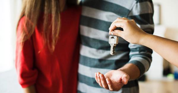 Couple Receiving Keys To Their New Home (1)