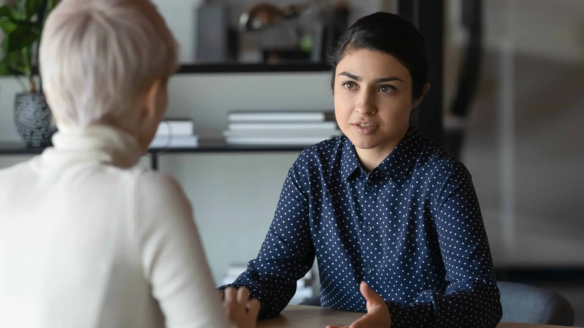 Young Women Talking To Each Other Reduced