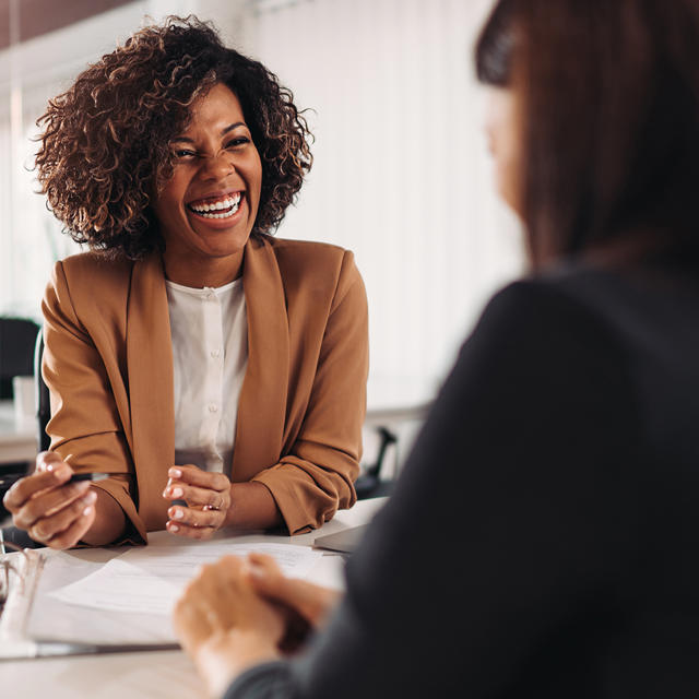 Two Women Talking Customer And Housing Officer