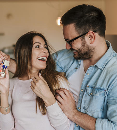 Young Couple With Keys To Home