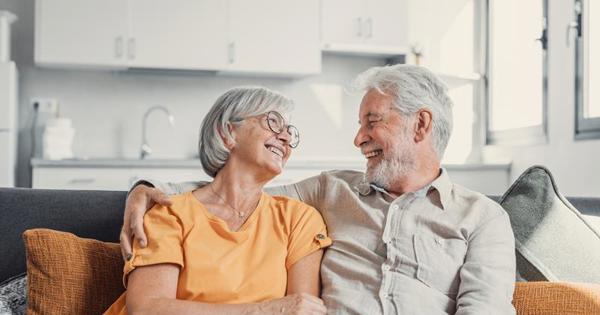 Older Couple Sat On The Sofa