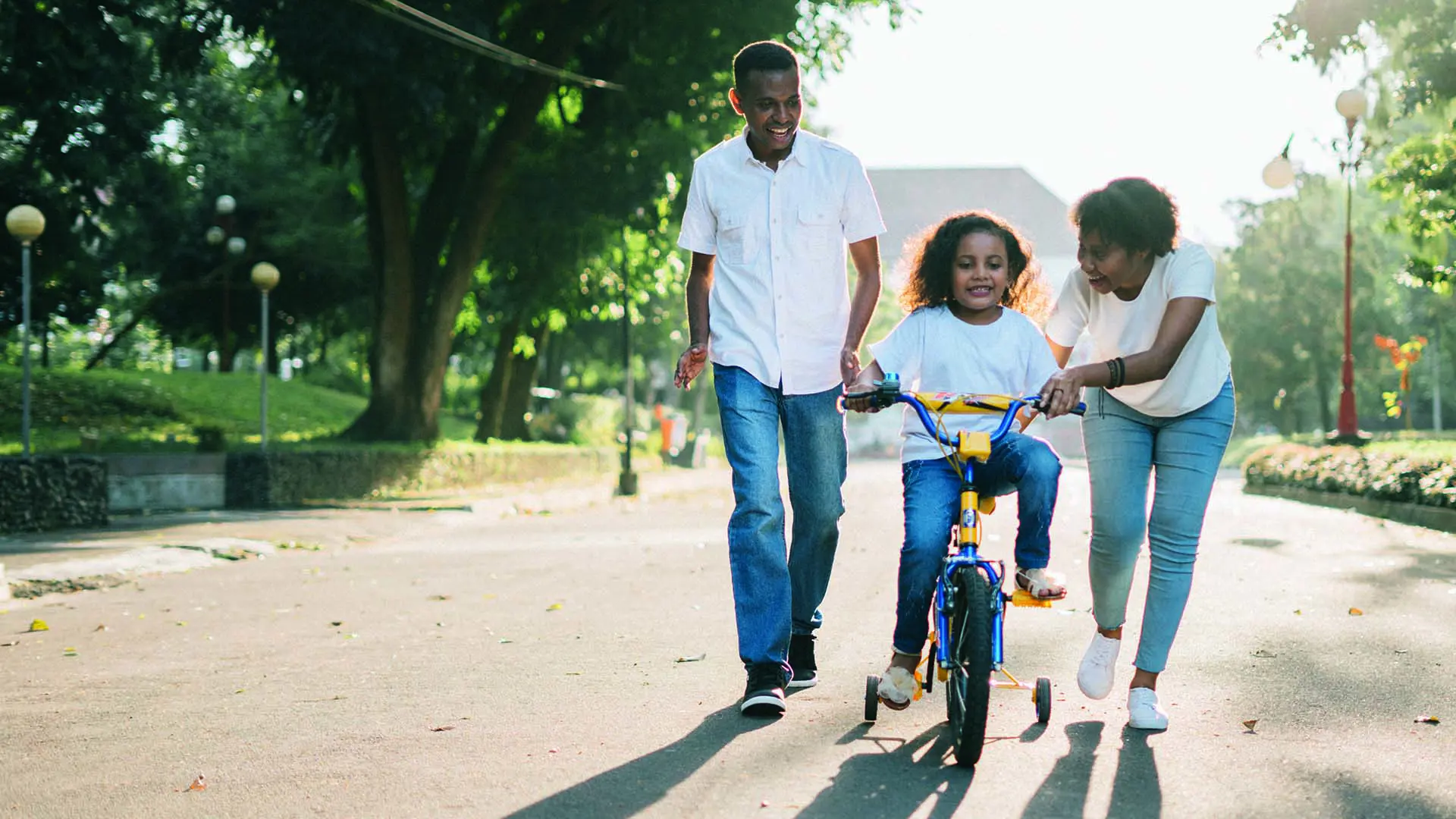 Parents With Child On Bike