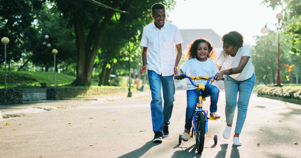 Parents With Child On Bike