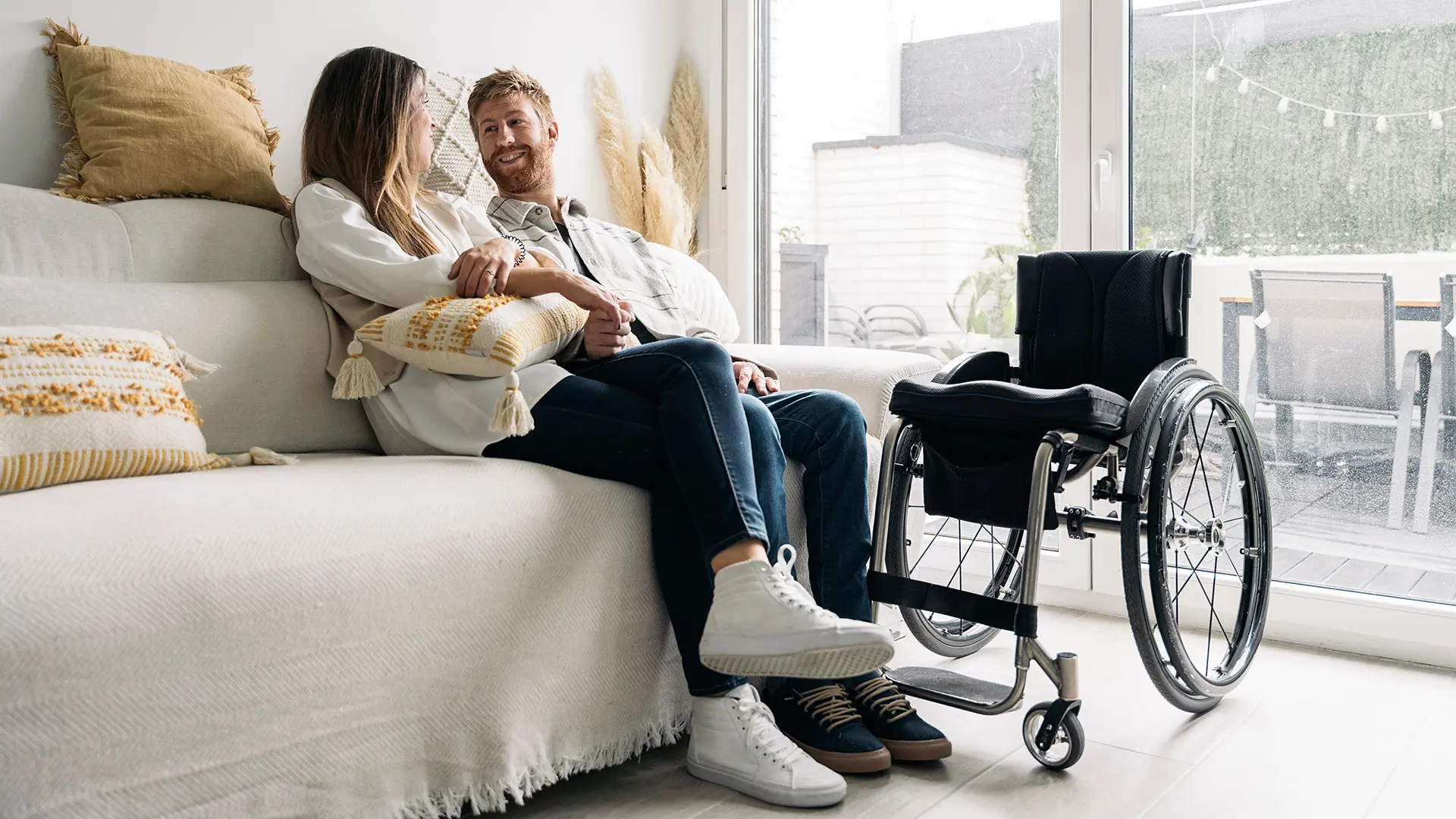 Couple At Home With Wheelchair