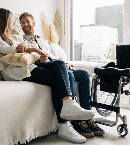 Couple At Home With Wheelchair