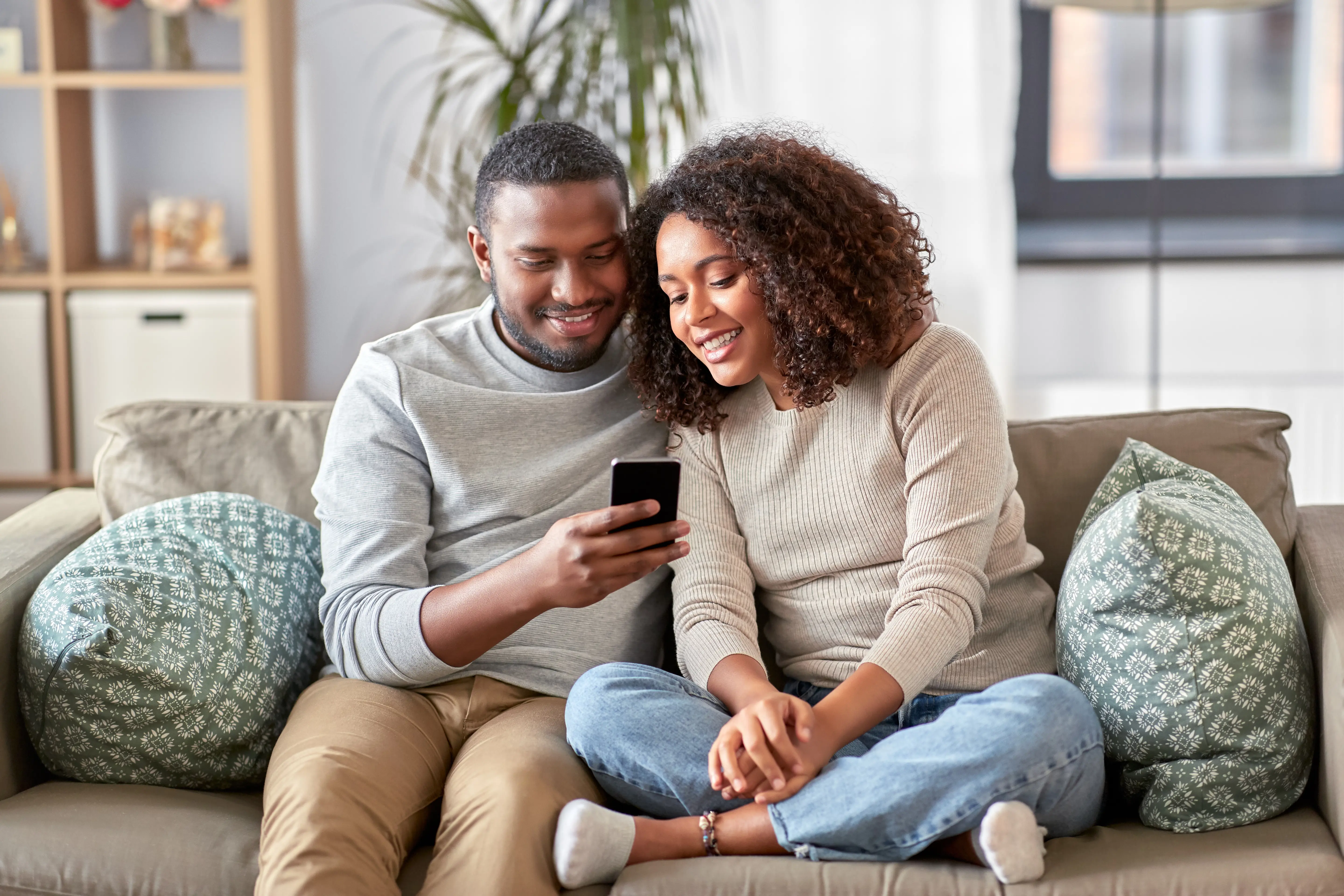 Couple Talking On Phone