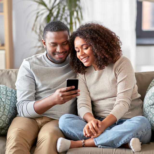 Couple Talking On Phone