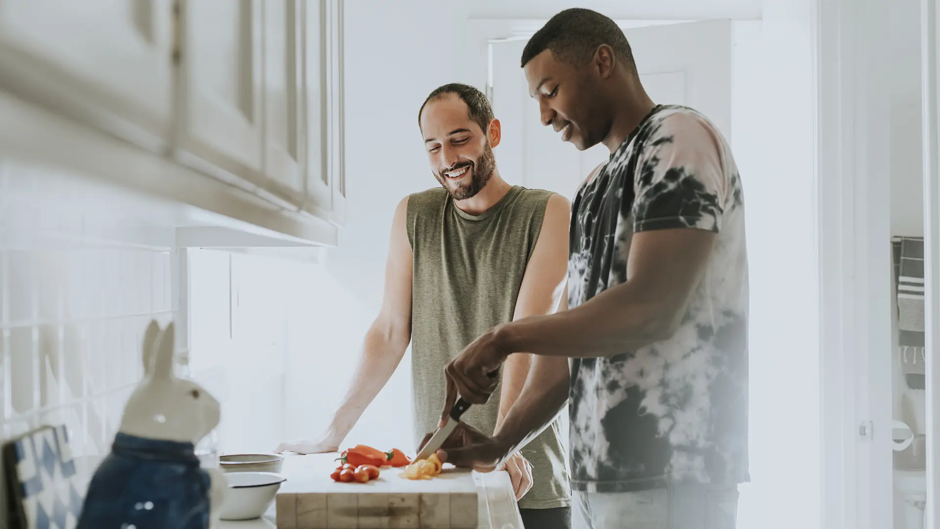 Couple Cooking In Kitchen