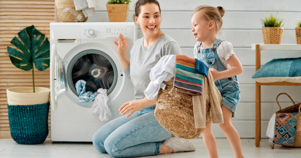 Mum And Child Doing The Washing Together (1)