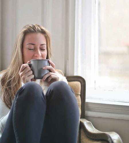 Woman In Her Home Relaxing