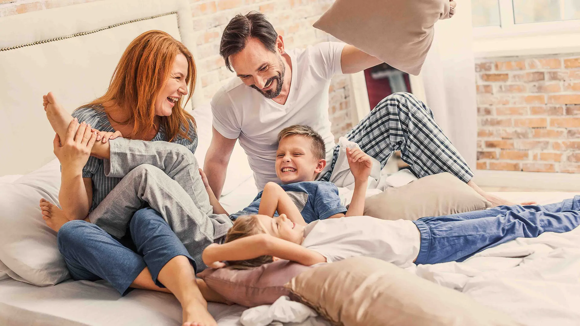 Young Family Being Playful At Home