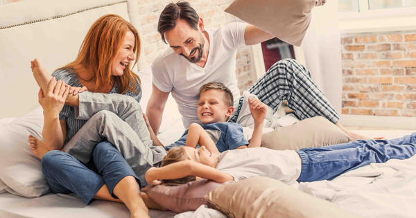 Young Family Being Playful At Home